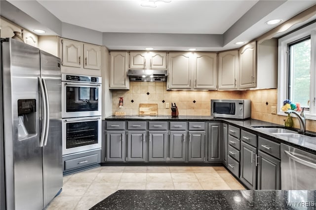 8395 Black Walnut Dr, Clarence, NY 14051 - kitchen with appliances with stainless steel finishes, under cabinet range hood, gray cabinets, recessed lighting, and a sink