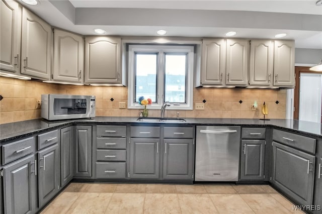 8395 Black Walnut Dr, Clarence, NY 14051 - kitchen with appliances with stainless steel finishes, gray cabinets, a sink, recessed lighting, and tasteful backsplash
