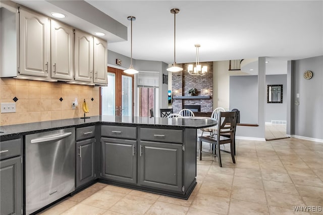 8395 Black Walnut Dr, Clarence, NY 14051 - kitchen with dishwasher, a peninsula, decorative backsplash, gray cabinetry, and a brick fireplace