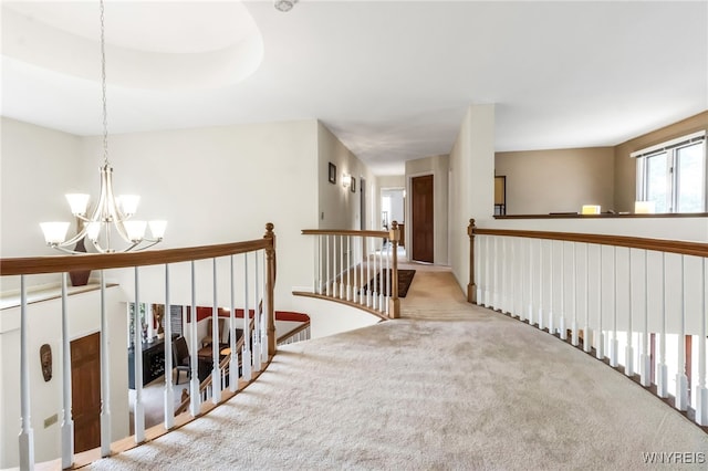 8395 Black Walnut Dr, Clarence, NY 14051 - corridor with an upstairs landing, a chandelier, and carpet