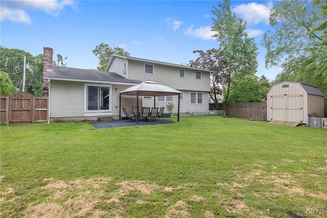 8013 Plinius, Clay, NY 13090 - rear view of property featuring a gazebo, a patio, and a chimney
