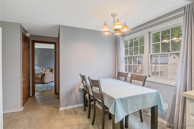 8013 Plinius, Clay, NY 13090 - dining space with baseboards and a chandelier