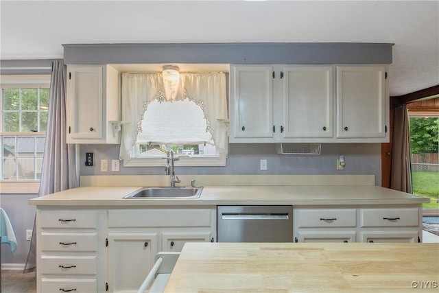 8013 Plinius, Clay, NY 13090 - kitchen with dishwasher, a sink, light countertops, and white cabinets