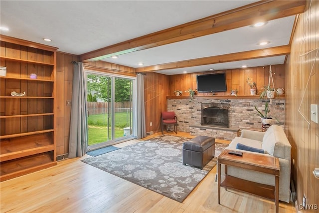 8013 Plinius, Clay, NY 13090 - living room with wood finished floors, a brick fireplace, wood walls, beamed ceiling, and recessed lighting