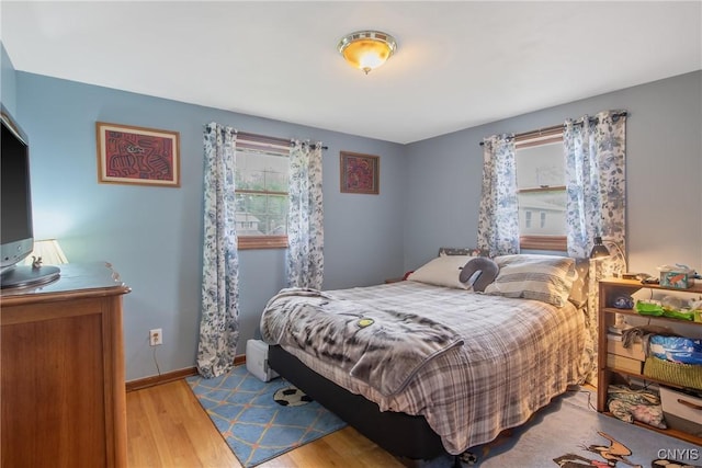 8013 Plinius, Clay, NY 13090 - bedroom featuring wood finished floors and baseboards