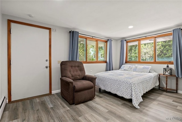 79 Windermere Blvd, Amherst, NY 14226 - bedroom with light wood-type flooring, baseboard heating, baseboards, and recessed lighting