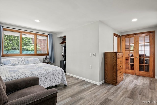 79 Windermere Blvd, Amherst, NY 14226 - bedroom featuring french doors, light wood-type flooring, baseboards, and recessed lighting