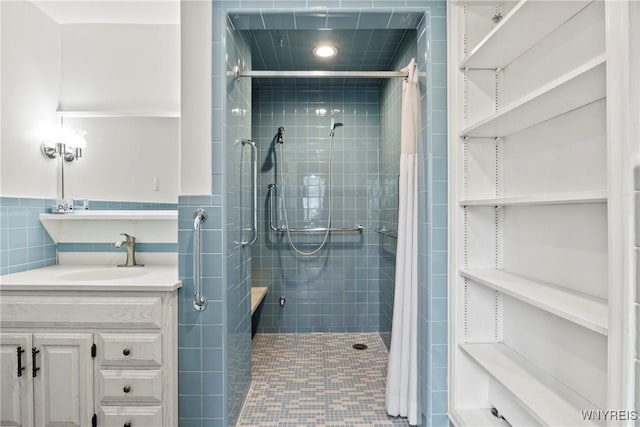 79 Windermere Blvd, Amherst, NY 14226 - bathroom with a stall shower, vanity, tile walls, and recessed lighting