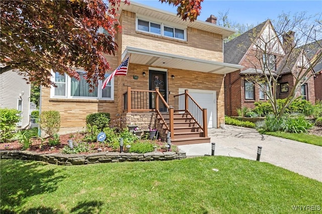 79 Windermere Blvd, Amherst, NY 14226 - view of front of home featuring brick siding, concrete driveway, a front lawn, and a garage