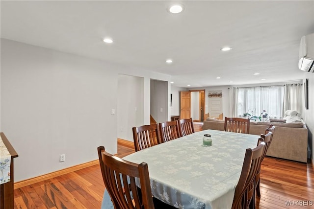 79 Windermere Blvd, Amherst, NY 14226 - dining area featuring baseboards, recessed lighting, wood finished floors, and an AC wall unit