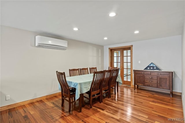79 Windermere Blvd, Amherst, NY 14226 - dining room featuring a wall mounted air conditioner, french doors, light wood-type flooring, recessed lighting, and baseboards