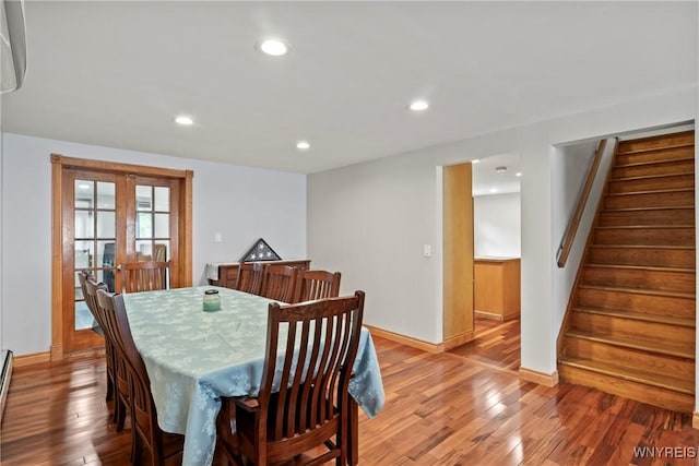 79 Windermere Blvd, Amherst, NY 14226 - dining room with light wood-type flooring, stairway, baseboards, recessed lighting, and a baseboard heating unit