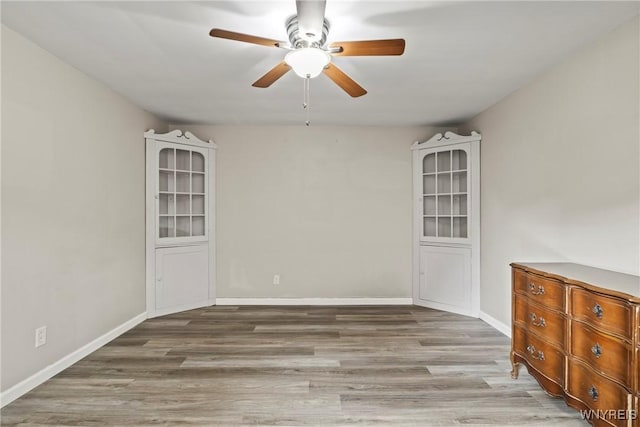 79 Windermere Blvd, Amherst, NY 14226 - empty room featuring ceiling fan, wood finished floors, and baseboards