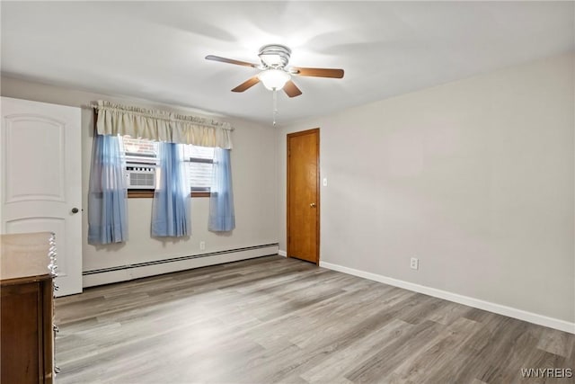 79 Windermere Blvd, Amherst, NY 14226 - empty room with a baseboard radiator, light wood-style floors, ceiling fan, baseboards, and cooling unit