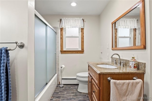 79 Windermere Blvd, Amherst, NY 14226 - full bath featuring a baseboard heating unit, vanity, toilet, wood finished floors, and combined bath / shower with glass door