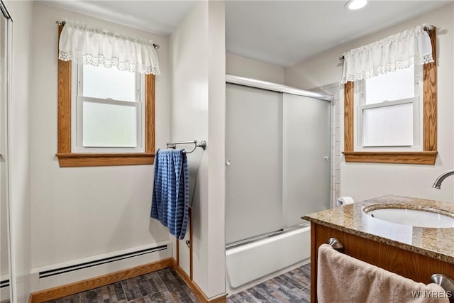 79 Windermere Blvd, Amherst, NY 14226 - full bath with plenty of natural light, baseboard heating, vanity, enclosed tub / shower combo, and recessed lighting