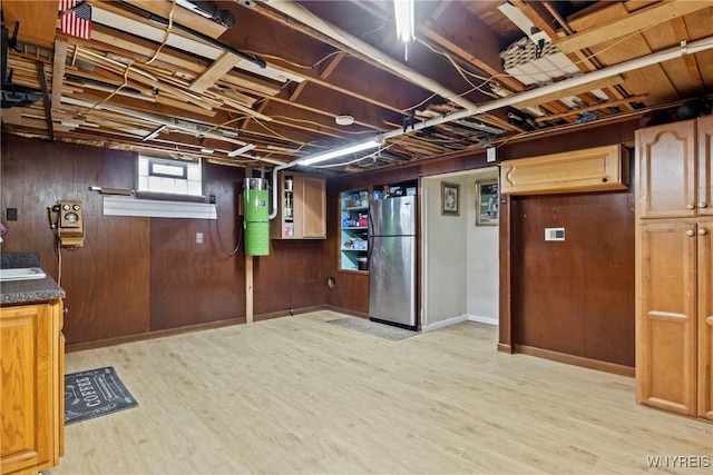 79 Windermere Blvd, Amherst, NY 14226 - below grade area featuring freestanding refrigerator, a central vacuum unit, wood finished floors, baseboards, and wooden walls