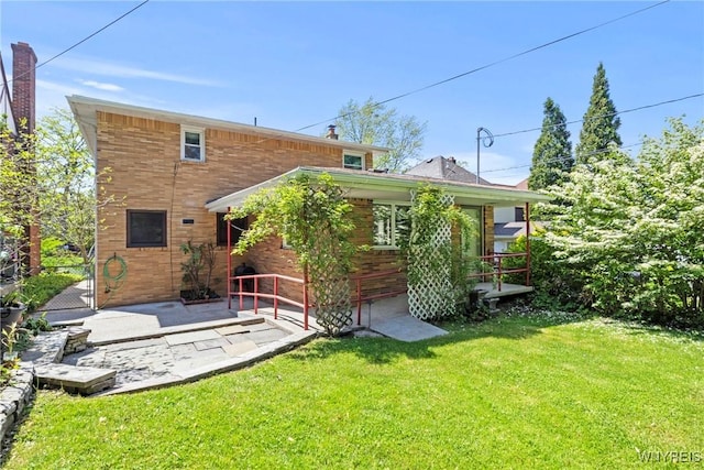 79 Windermere Blvd, Amherst, NY 14226 - back of property with a lawn and a patio area