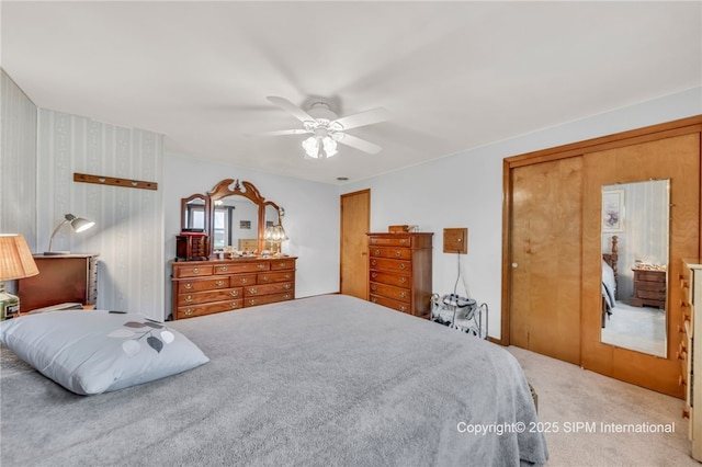 393 Bauman Rd, Amherst, NY 14221 - bedroom featuring carpet, two closets, and a ceiling fan