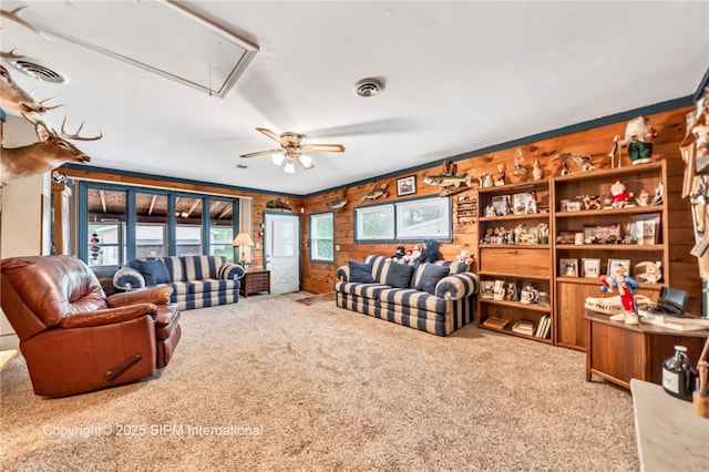 393 Bauman Rd, Amherst, NY 14221 - living area featuring attic access, carpet, a ceiling fan, and wood walls