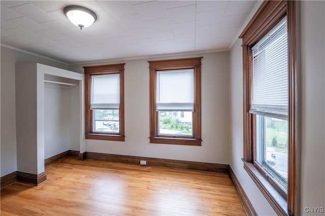 611 Turin St, Rome-Inside, NY 13440 - unfurnished bedroom with light wood-style floors, crown molding, baseboards, and a closet