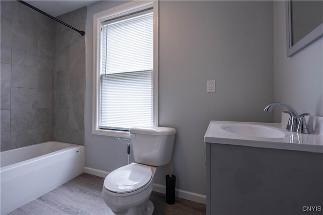 611 Turin St, Rome-Inside, NY 13440 - full bathroom featuring toilet, vanity, wood finished floors, shower / tub combination, and baseboards