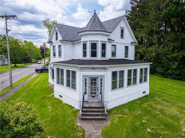 611 Turin St, Rome-Inside, NY 13440 - rear view of house featuring roof with shingles, entry steps, and a yard