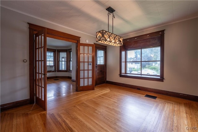 611 Turin St, Rome-Inside, NY 13440 - empty room featuring french doors, baseboards, crown molding, plenty of natural light, and light wood-style flooring