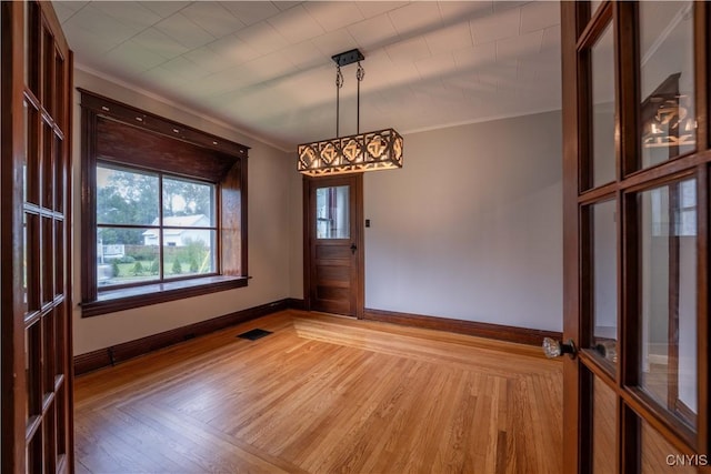 611 Turin St, Rome-Inside, NY 13440 - spare room with baseboards, light wood-type flooring, and crown molding