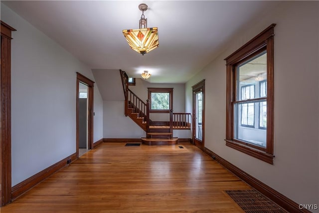 611 Turin St, Rome-Inside, NY 13440 - foyer featuring wood finished floors, baseboards, and stairway