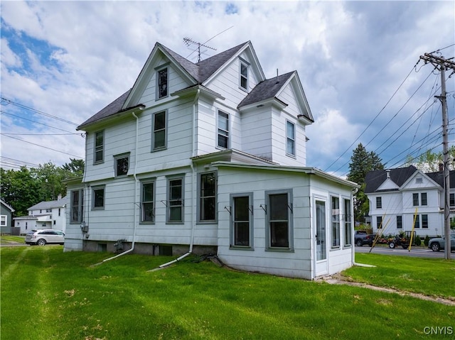 611 Turin St, Rome-Inside, NY 13440 - view of side of home featuring a lawn and a shingled roof