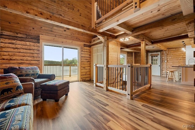 1159 Hunt Rd, Forestport, NY 13494 - living room featuring wood ceiling with exposed beams, wood finished floors, wood walls, and a water view