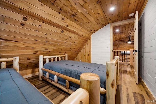1159 Hunt Rd, Forestport, NY 13494 - bedroom with wooden ceiling, vaulted ceiling, wood finished floors, and wooden walls