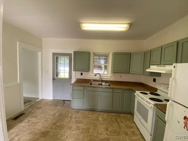 3 Genesee St, New Berlin, NY 13411 - kitchen featuring white appliances, a sink, under cabinet range hood, and green cabinetry