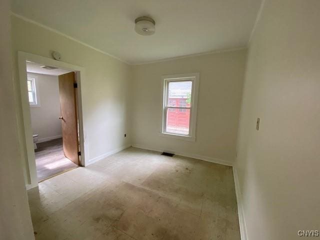 3 Genesee St, New Berlin, NY 13411 - unfurnished room featuring plenty of natural light, ornamental molding, and baseboards