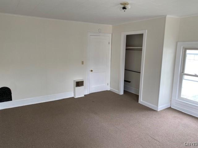 3 Genesee St, New Berlin, NY 13411 - unfurnished bedroom featuring carpet, baseboards, ornamental molding, and a closet