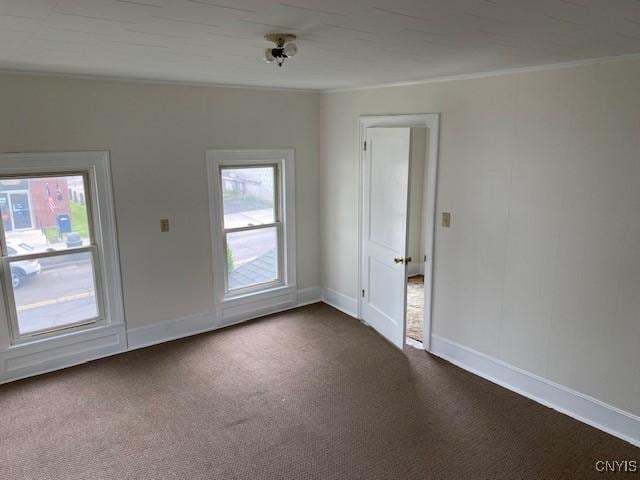 3 Genesee St, New Berlin, NY 13411 - unfurnished room with dark carpet, crown molding, and baseboards