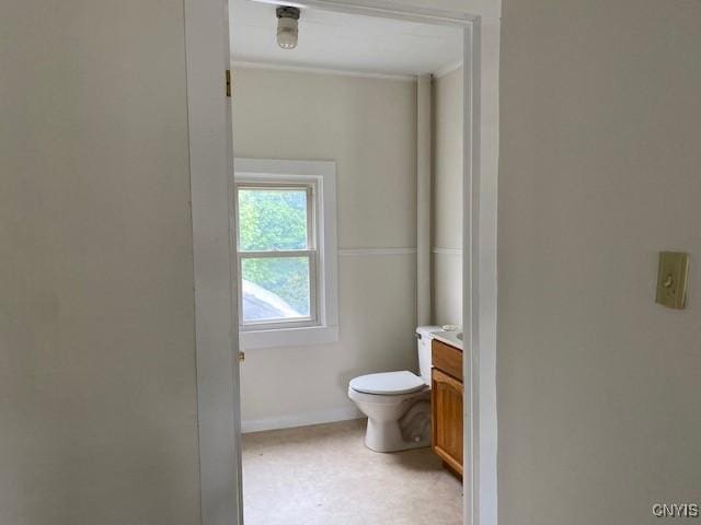 3 Genesee St, New Berlin, NY 13411 - bathroom with toilet, vanity, baseboards, and ornamental molding