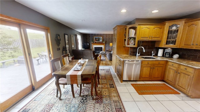 7404 Bonney Hill Rd, Hamilton, NY 13346 - kitchen with dishwasher, a sink, brown cabinets, glass insert cabinets, and light stone countertops