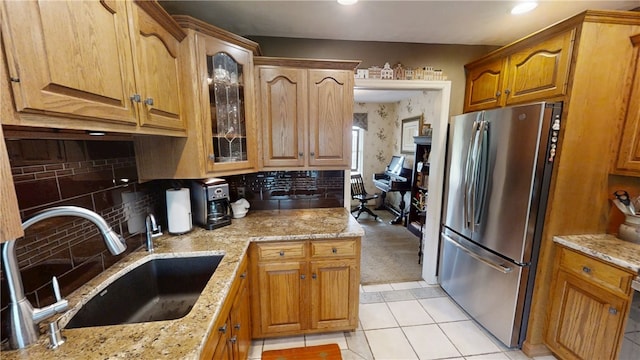 7404 Bonney Hill Rd, Hamilton, NY 13346 - kitchen with freestanding refrigerator, a sink, glass insert cabinets, light stone counters, and recessed lighting