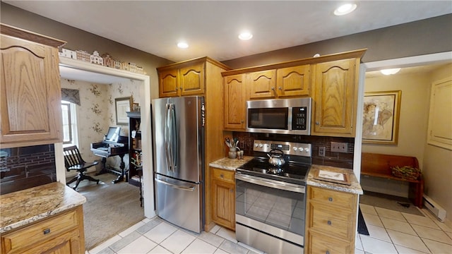 7404 Bonney Hill Rd, Hamilton, NY 13346 - kitchen featuring stainless steel appliances, light tile patterned flooring, light stone countertops, decorative backsplash, and recessed lighting