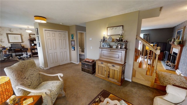 7404 Bonney Hill Rd, Hamilton, NY 13346 - living room featuring carpet, a fireplace, and baseboards