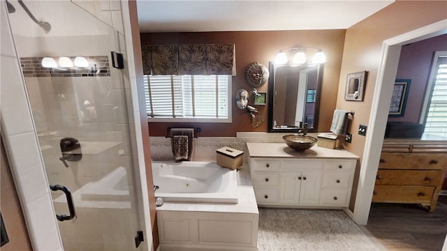 7404 Bonney Hill Rd, Hamilton, NY 13346 - full bath featuring a shower stall, vanity, a whirlpool tub, and wood finished floors