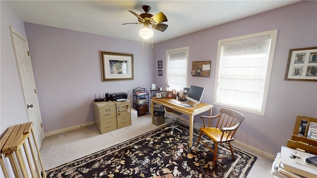 7404 Bonney Hill Rd, Hamilton, NY 13346 - home office featuring light carpet, ceiling fan, and baseboards