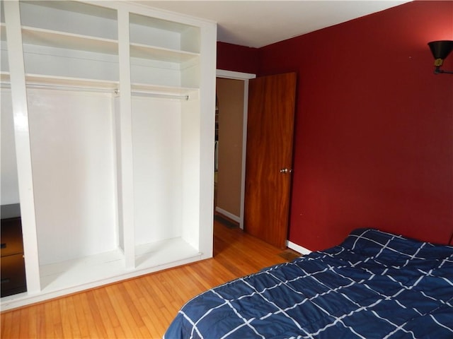 908 W 2nd St, Elmira, NY 14905 - bedroom featuring wood finished floors and a closet