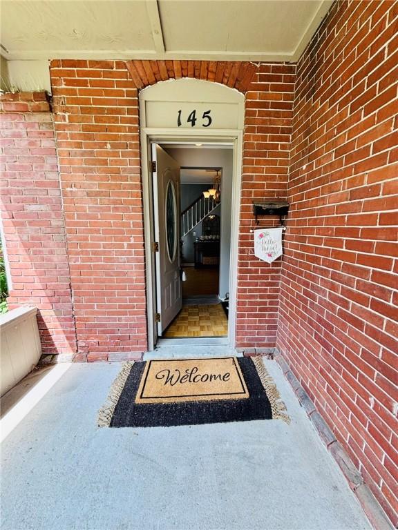 145 Decatur St, Corning-City, NY 14830 - view of exterior entry with brick siding