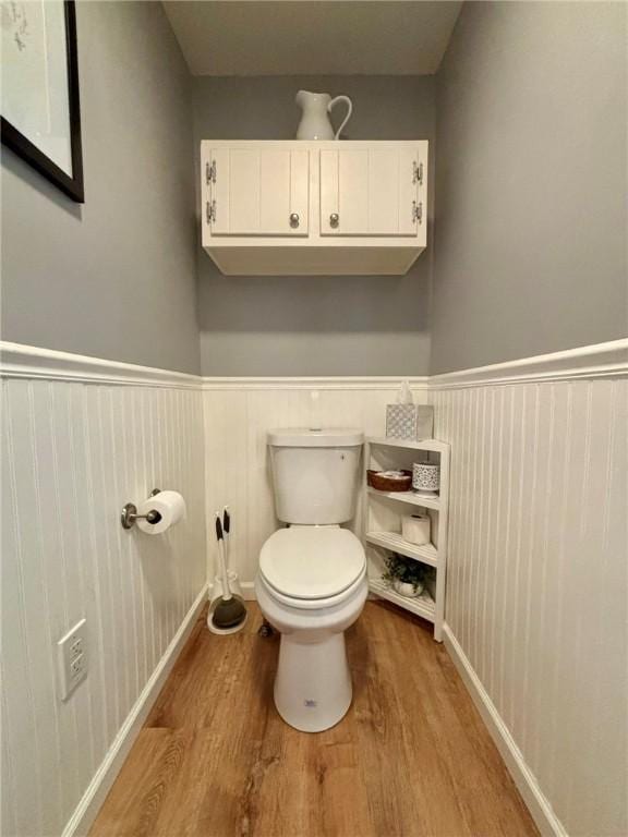 145 Decatur St, Corning-City, NY 14830 - bathroom with wood finished floors, a wainscoted wall, and toilet