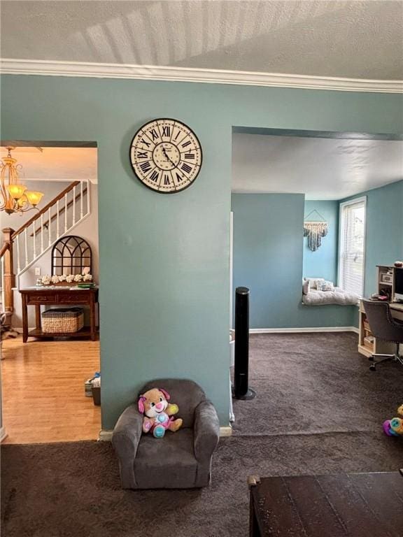 145 Decatur St, Corning-City, NY 14830 - carpeted living room with crown molding, a chandelier, stairs, baseboards, and a textured ceiling