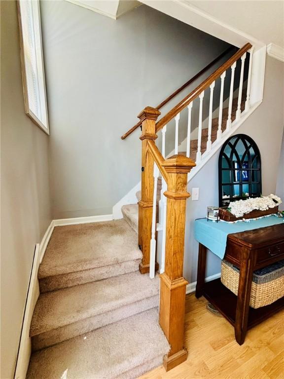 145 Decatur St, Corning-City, NY 14830 - staircase featuring wood finished floors and baseboards