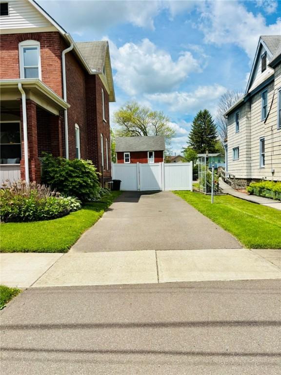 145 Decatur St, Corning-City, NY 14830 - view of property exterior with a gate and brick siding
